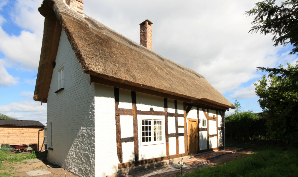 house with thermal upgrades and new thatched roof