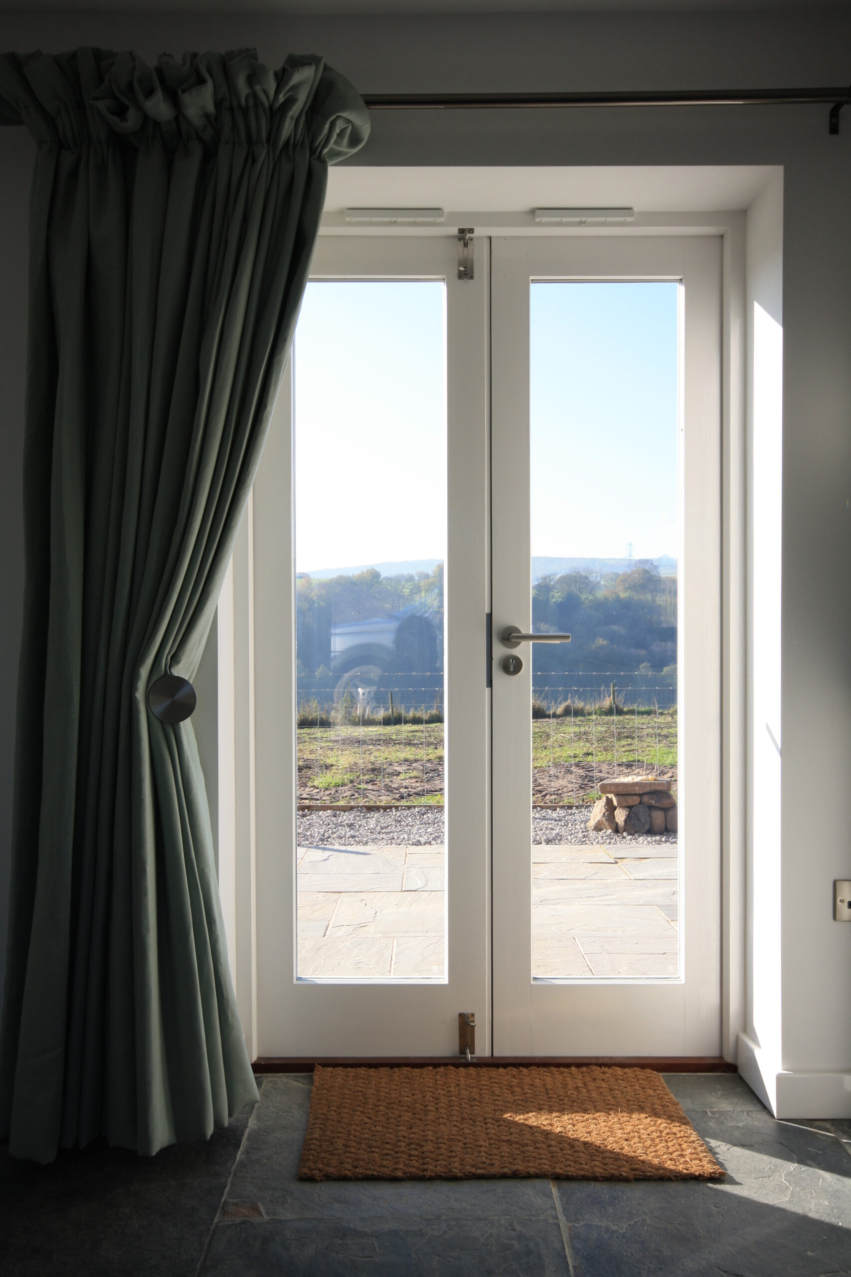 patio doors leading to external patio area with sweeping views of the countryside
