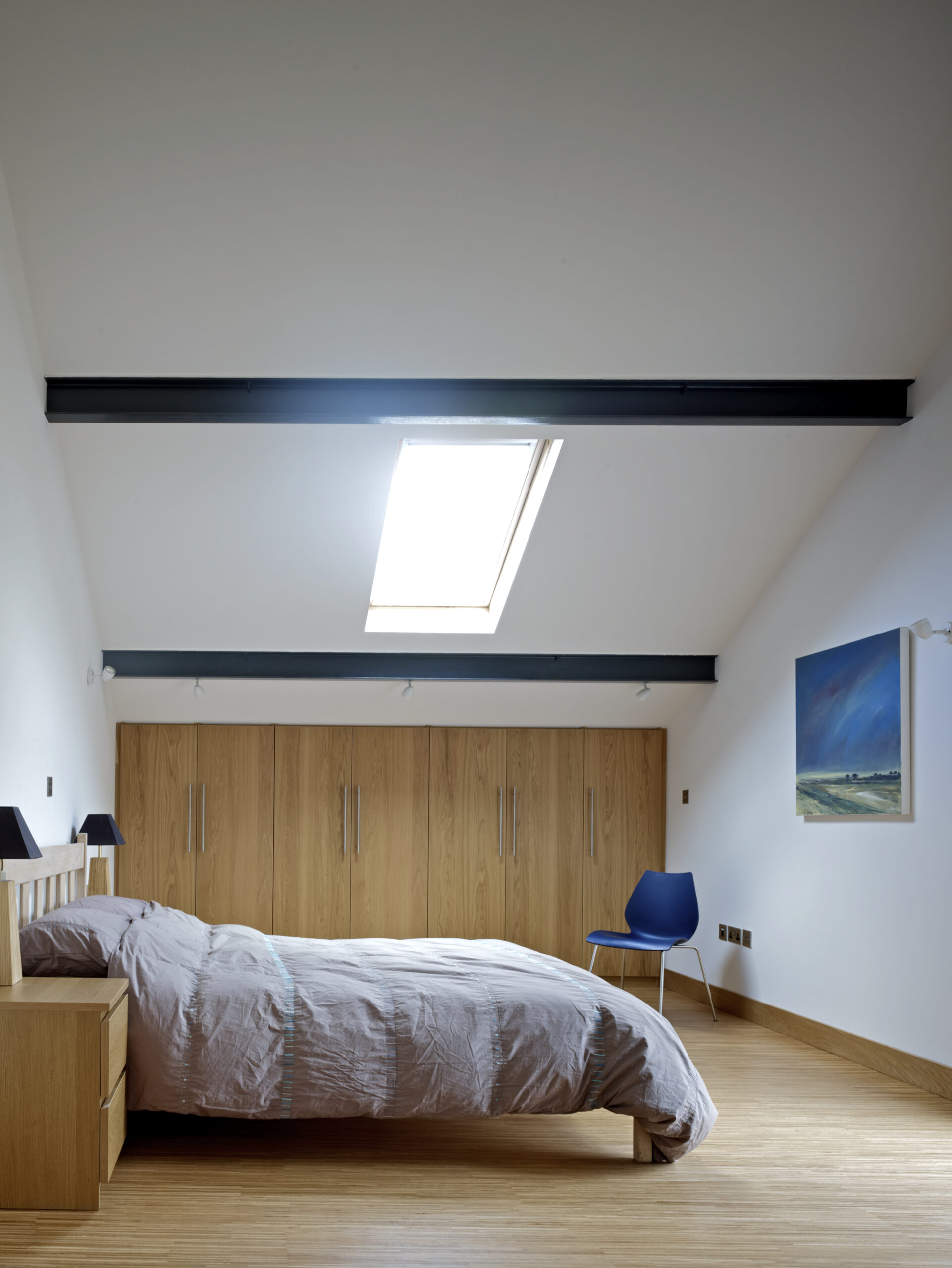first floor bedroom with rooflight and exposed steel roof structure