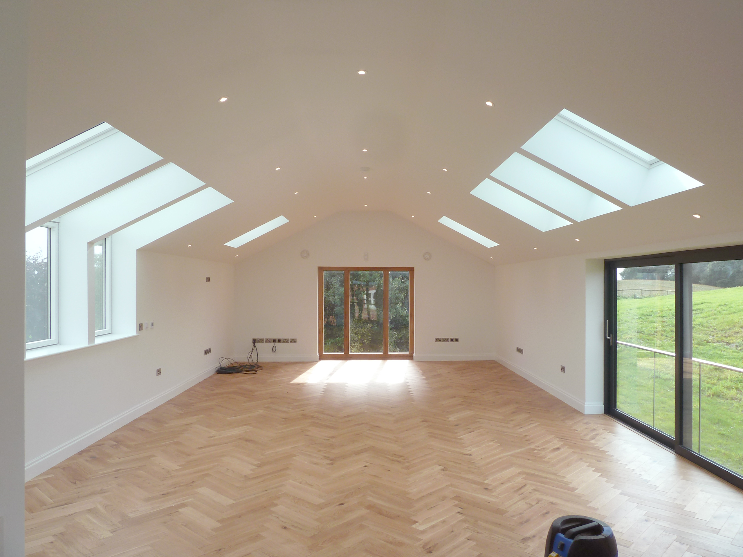 home office on the first floor of ancillary building with raked ceiling, up and over rooflights to the front elevation and oak framed glazing