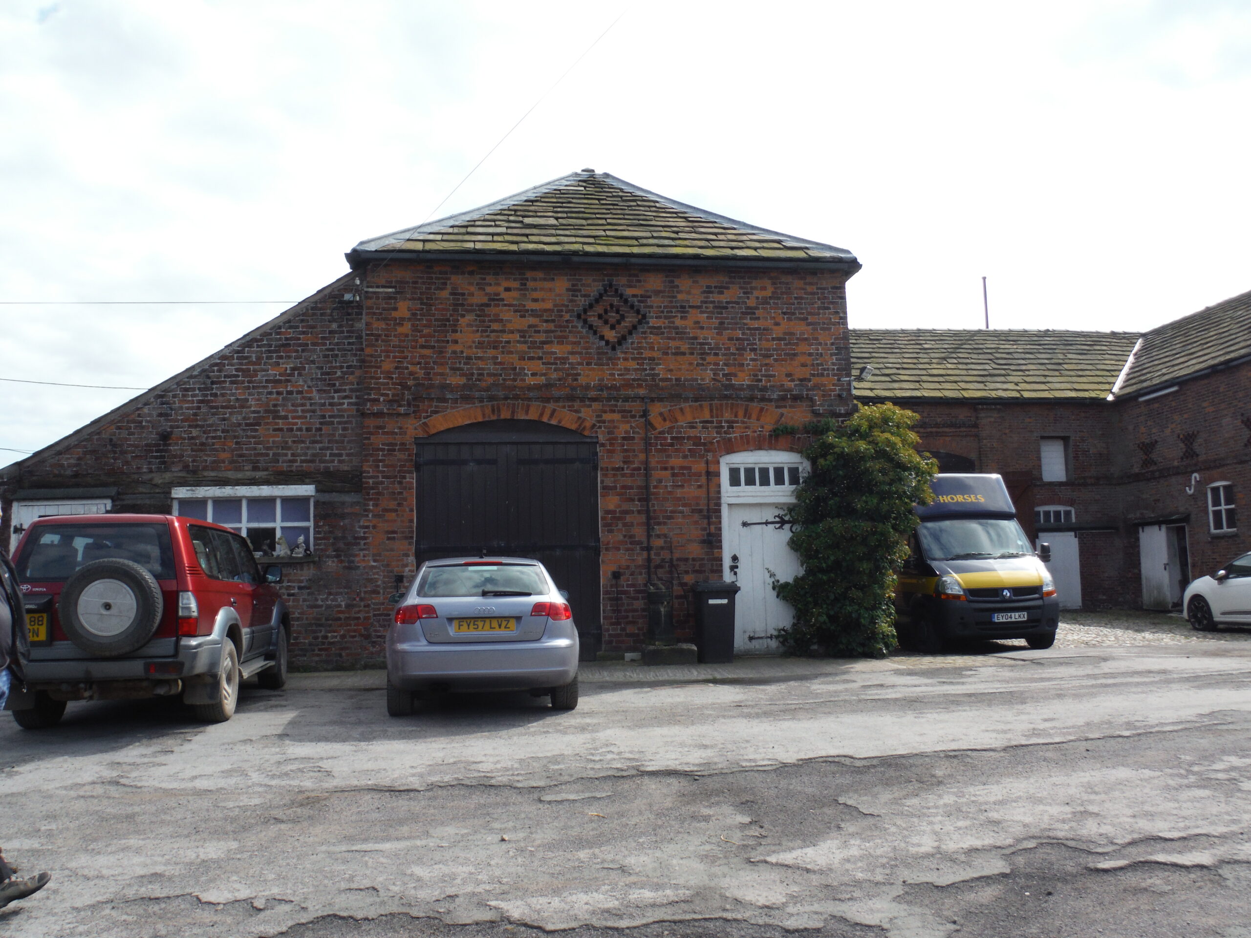 original coach house building with lean to side extension