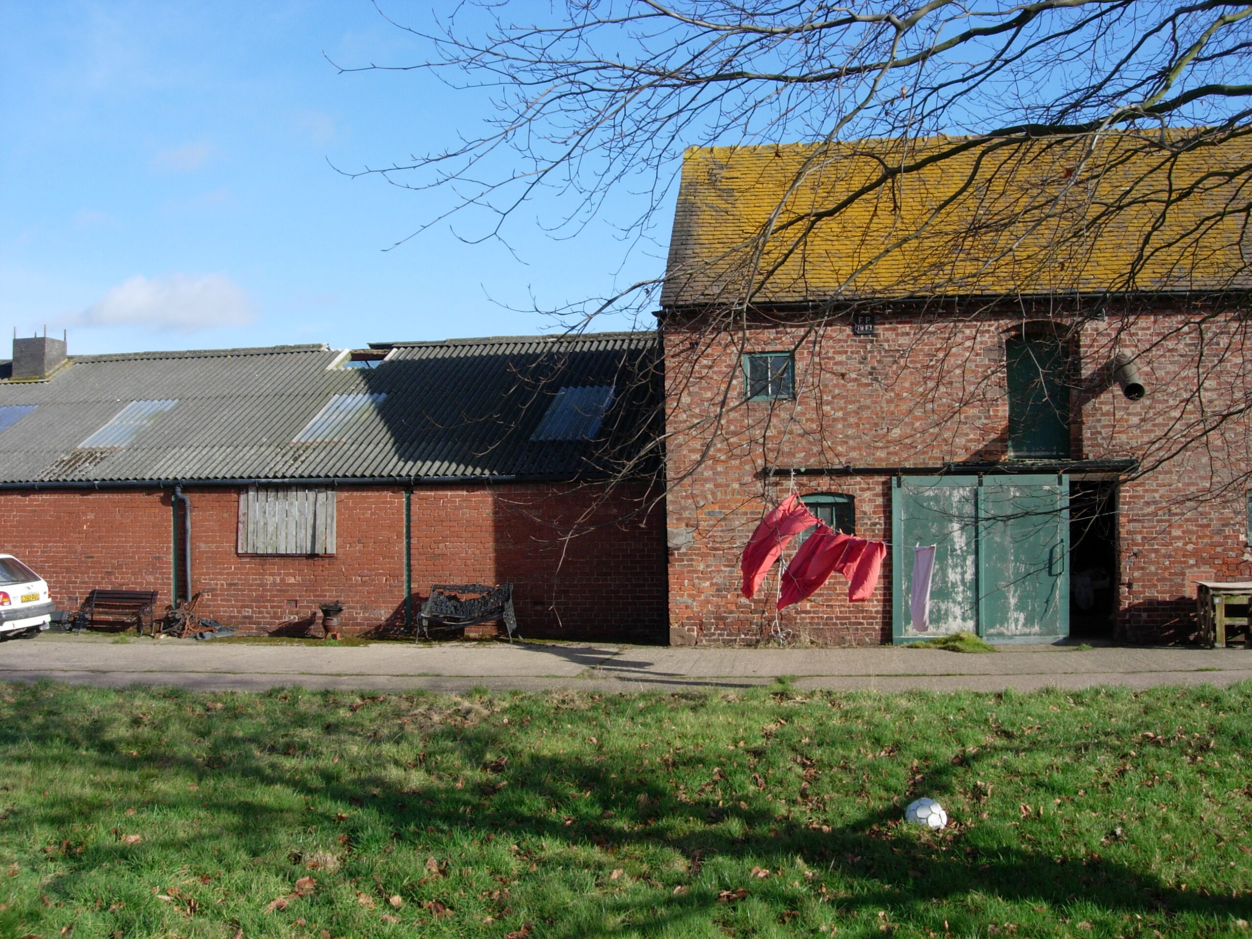 existing brick barns at Poole Farm corrugated roof and