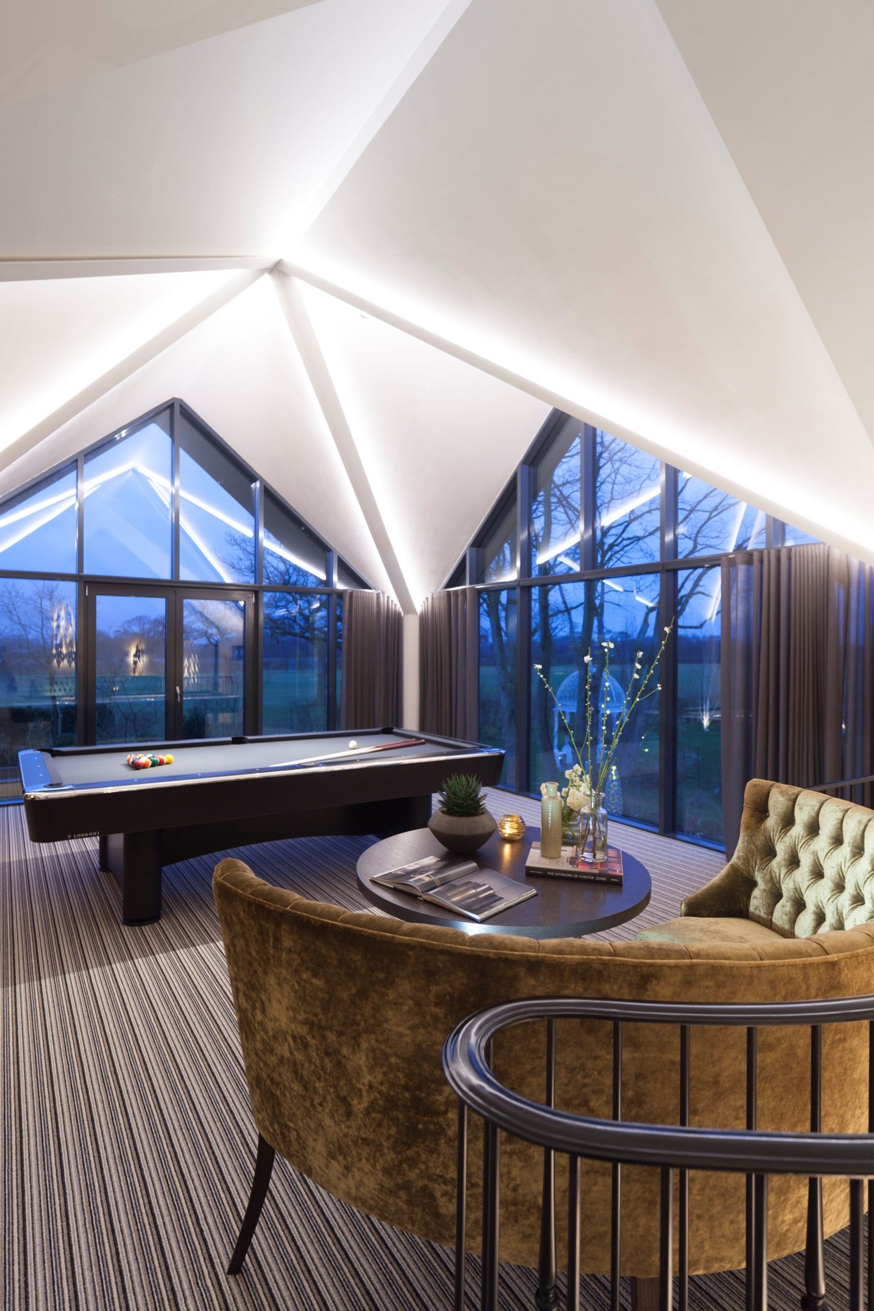 evening image of internal games room with concealed ceiling lighting