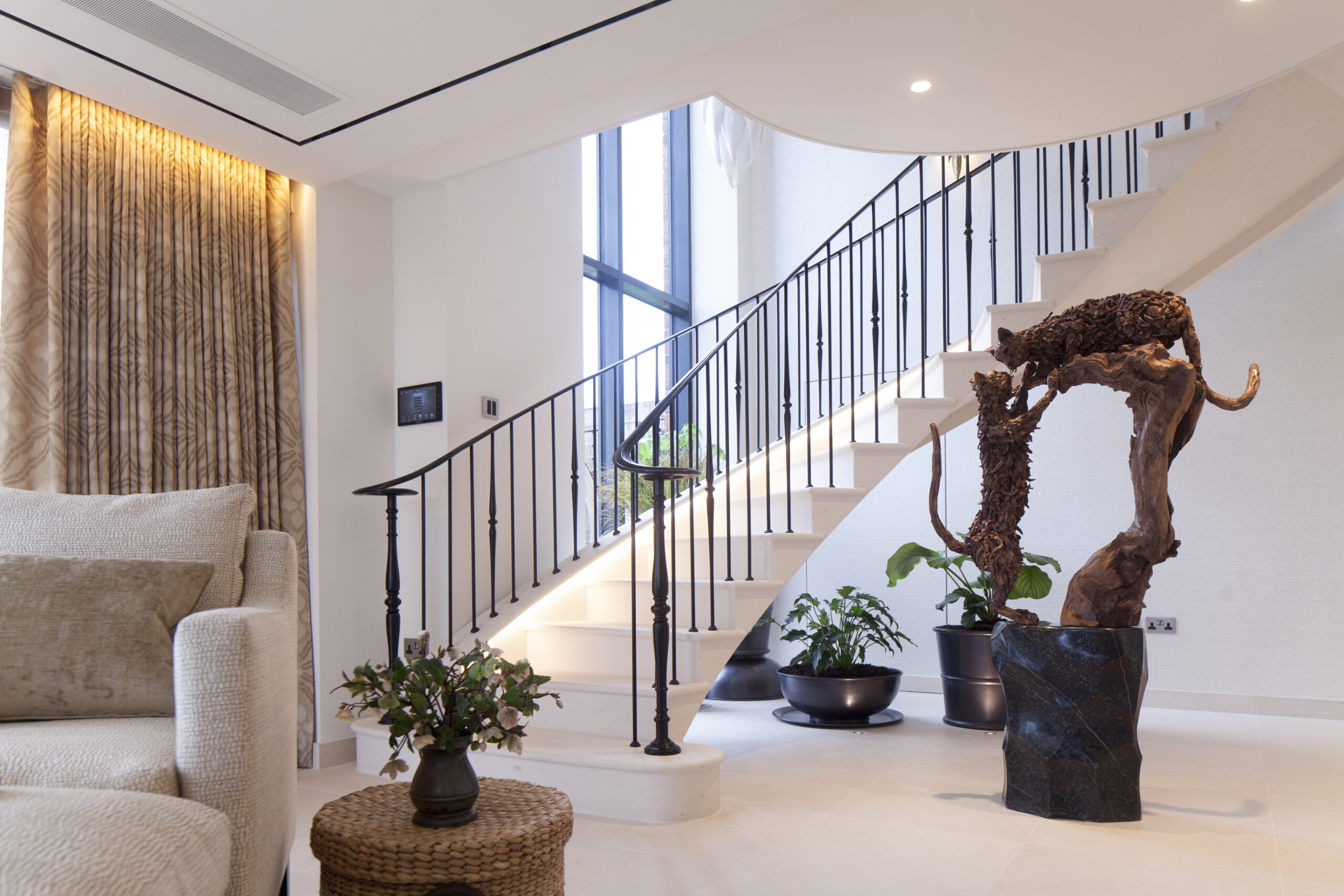 solid stone staircase with metal handrail and balustrade. Timber feature artwork