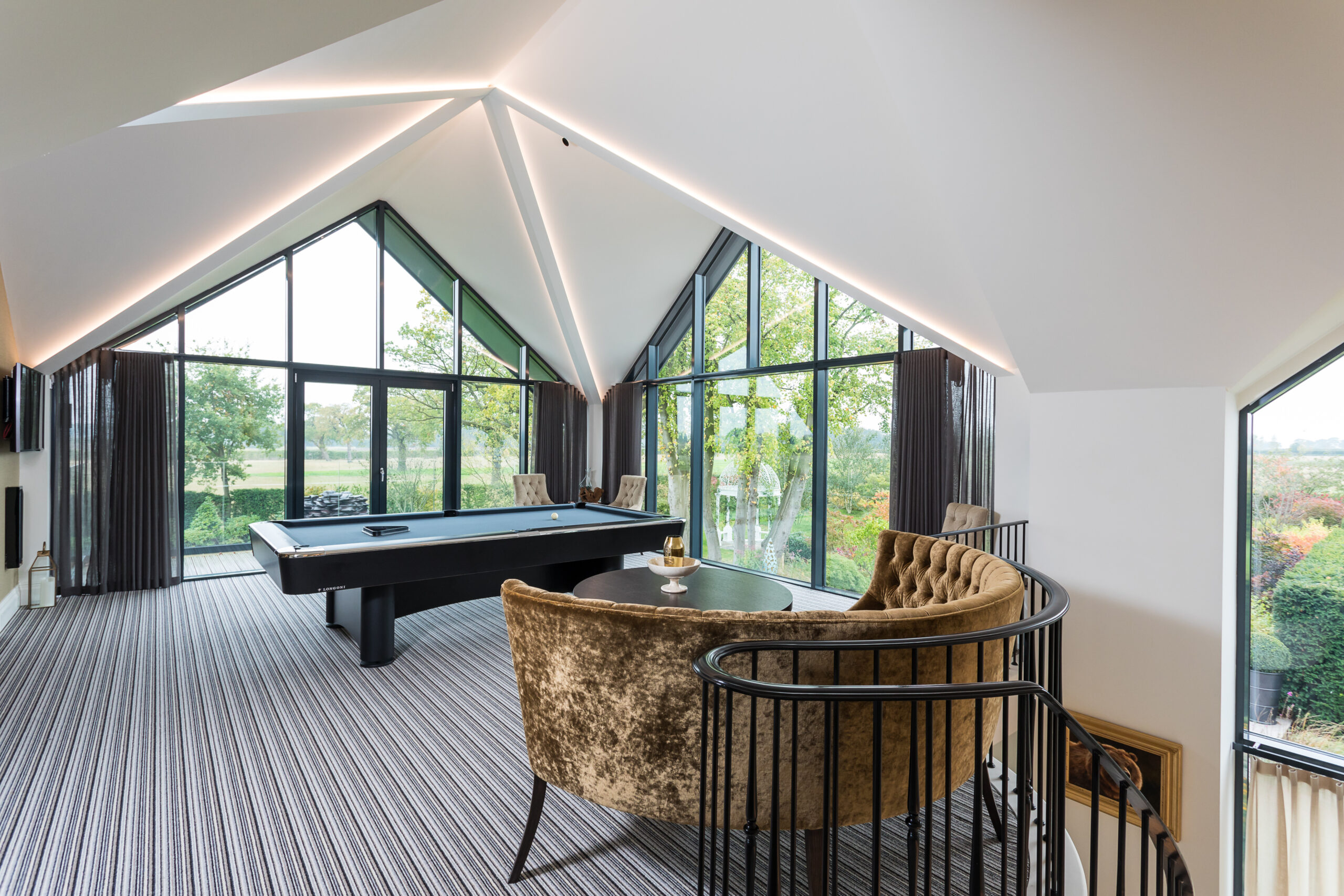 Ash House Games Room Games room extension with concealed lighting strips and large gable end glazing