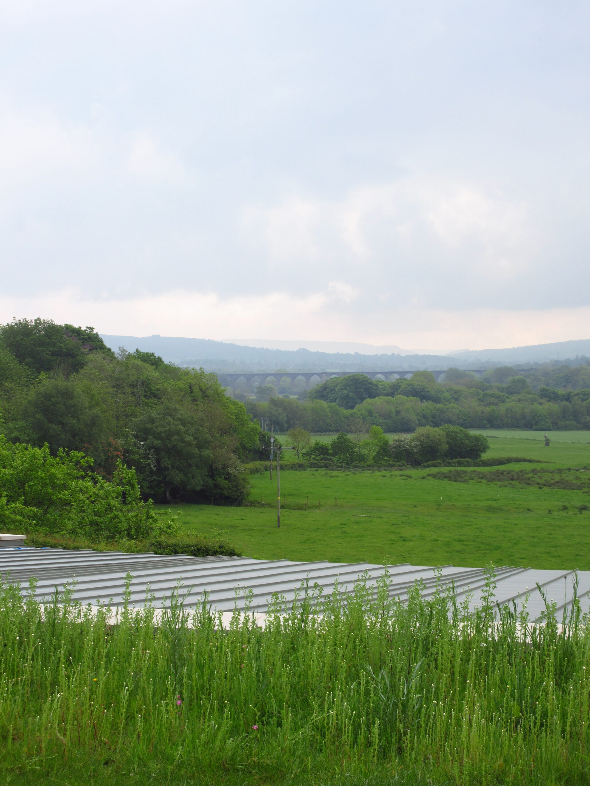 zinc roof of Bank Farm with the Viaduct visible in the distance
