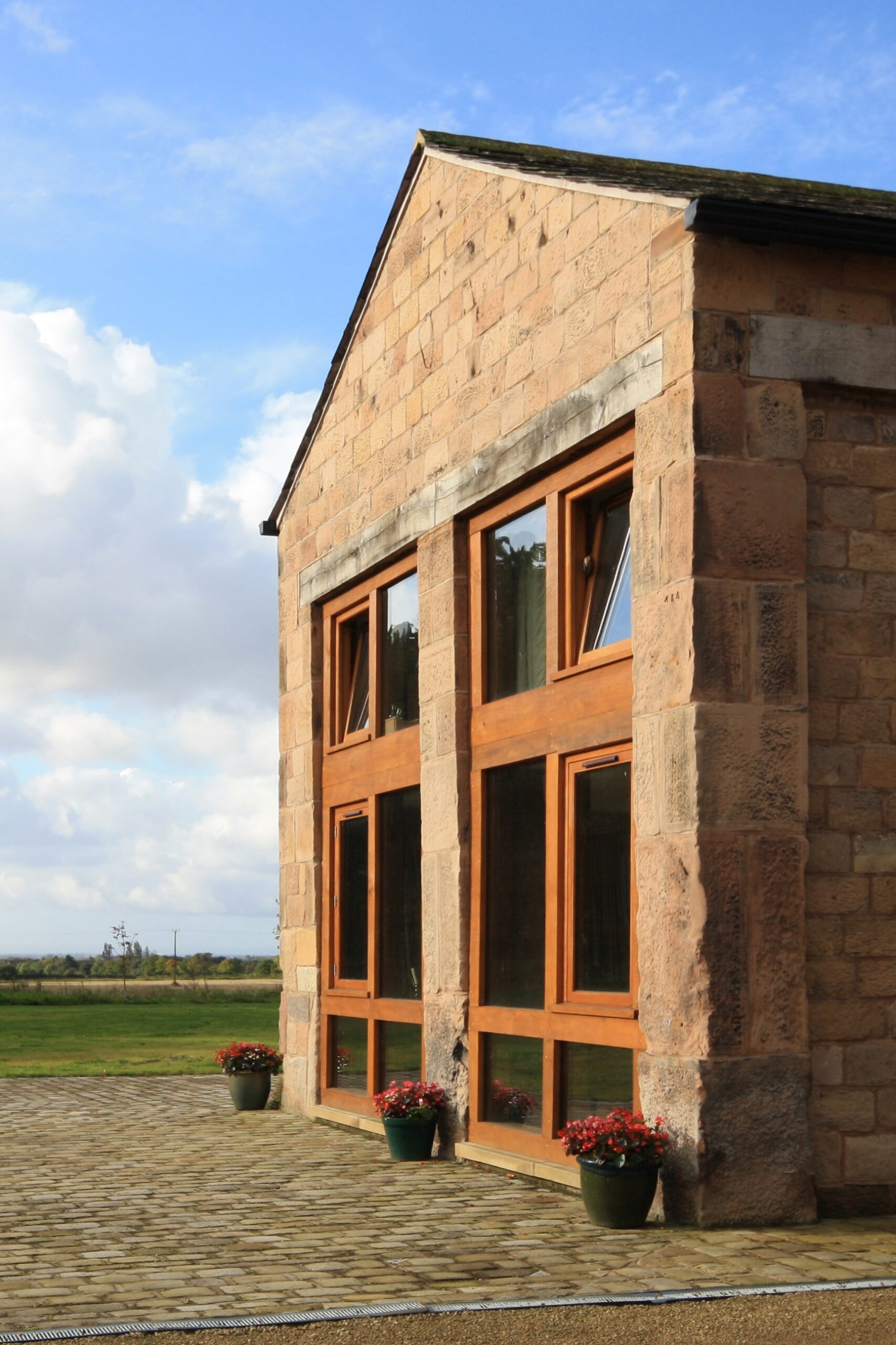 existing opening retained with new oak frame glazing to gable end of barn conversion