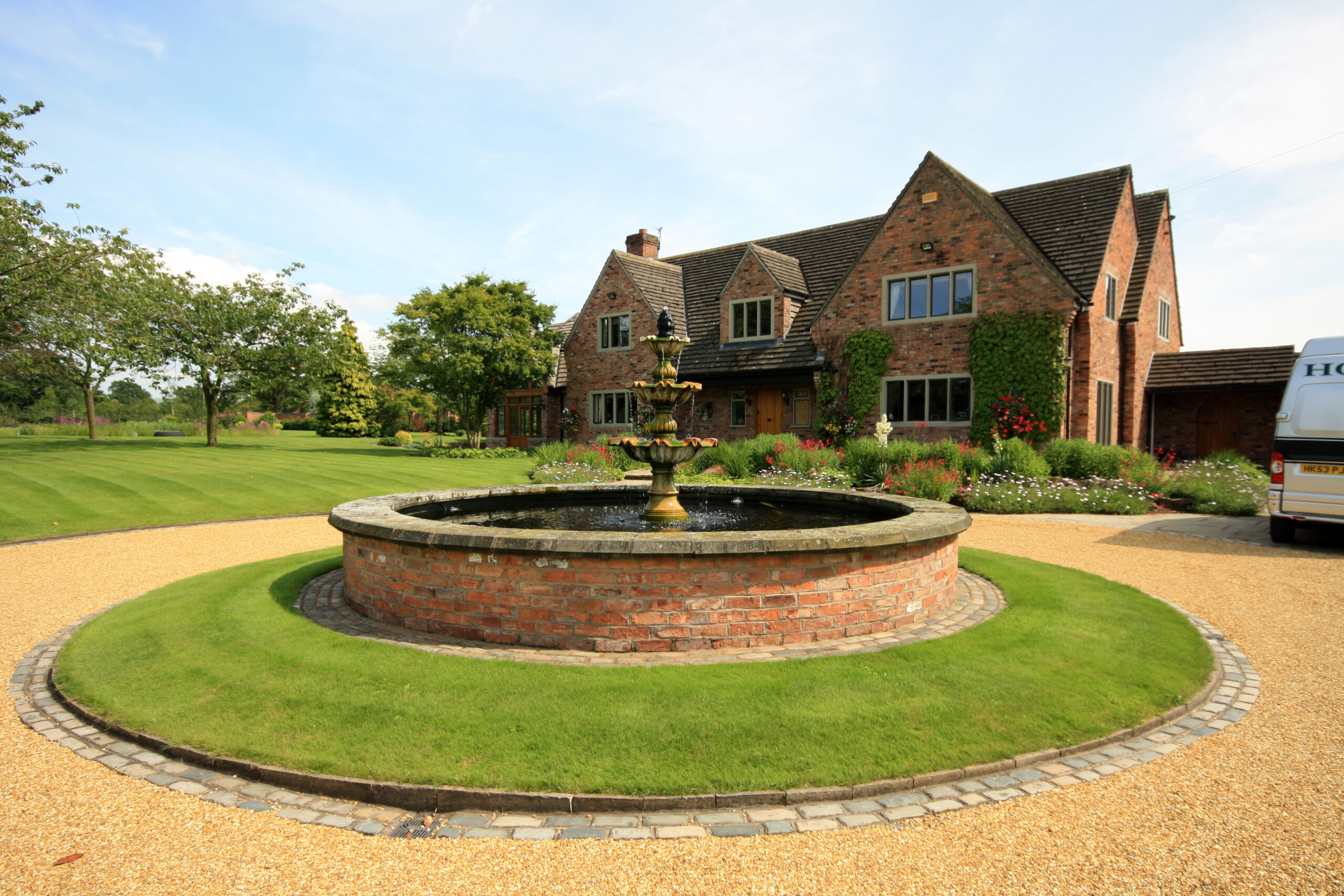 traditional front elevation of house with new extensions