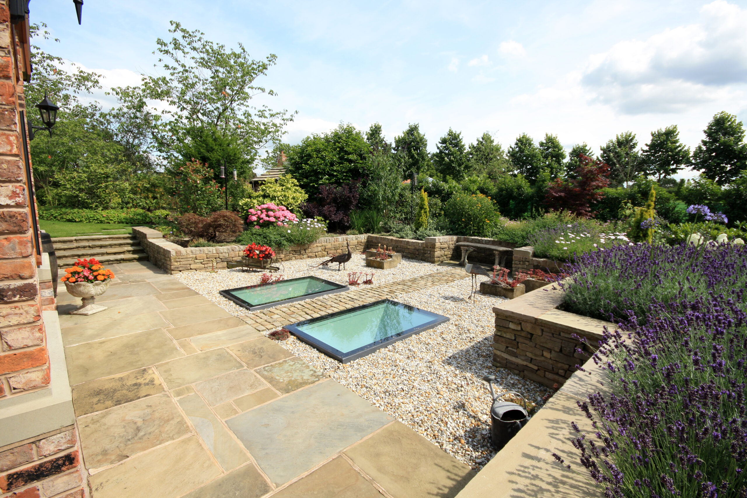 gardens with walk on rooflights providing natural light to the indoor pool below