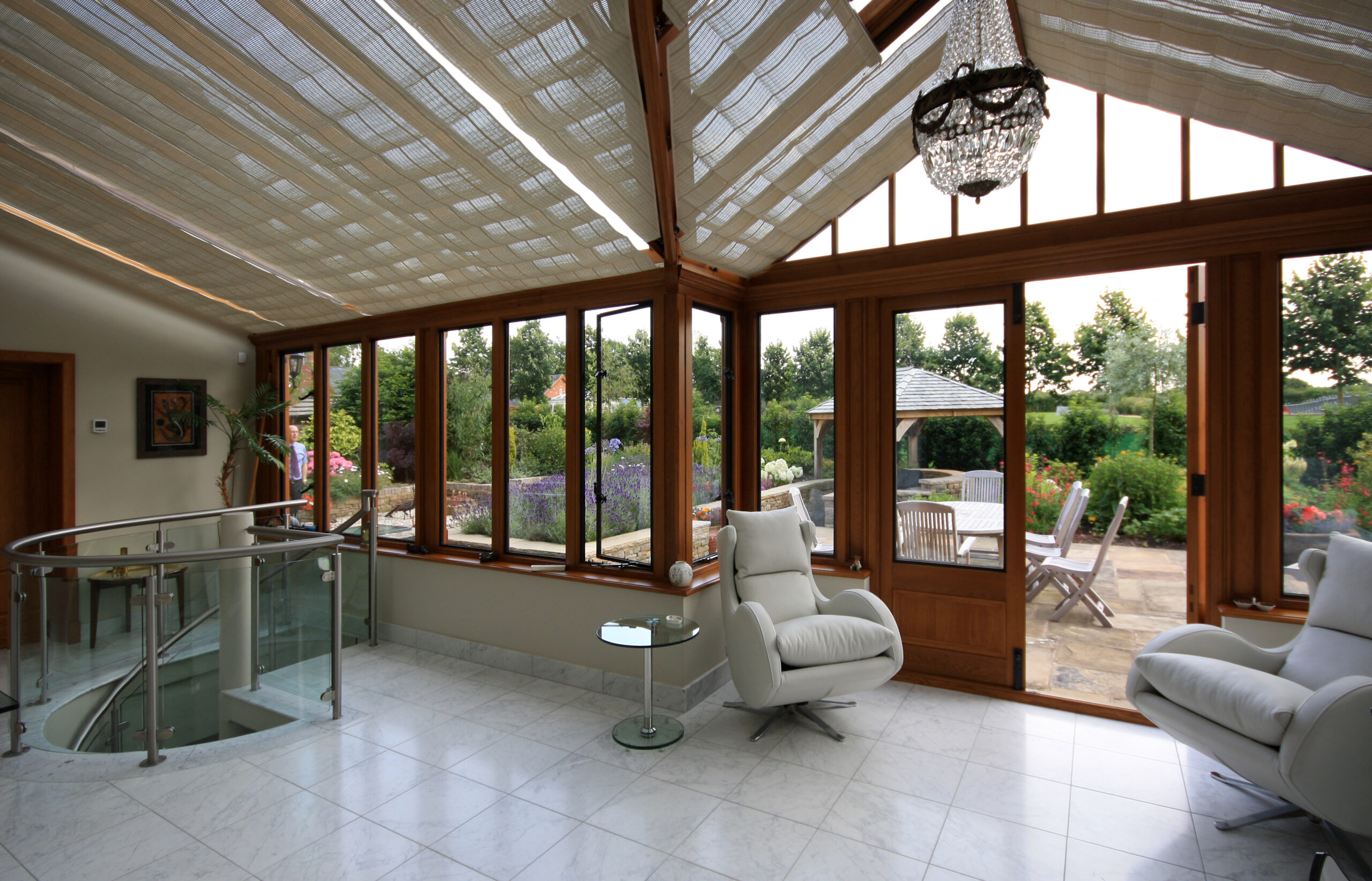 new garden room with oak framed glazing, linking house to leisure suite extensions