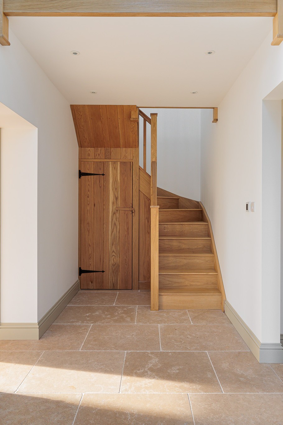 new timber staircase with under stairs cupboard