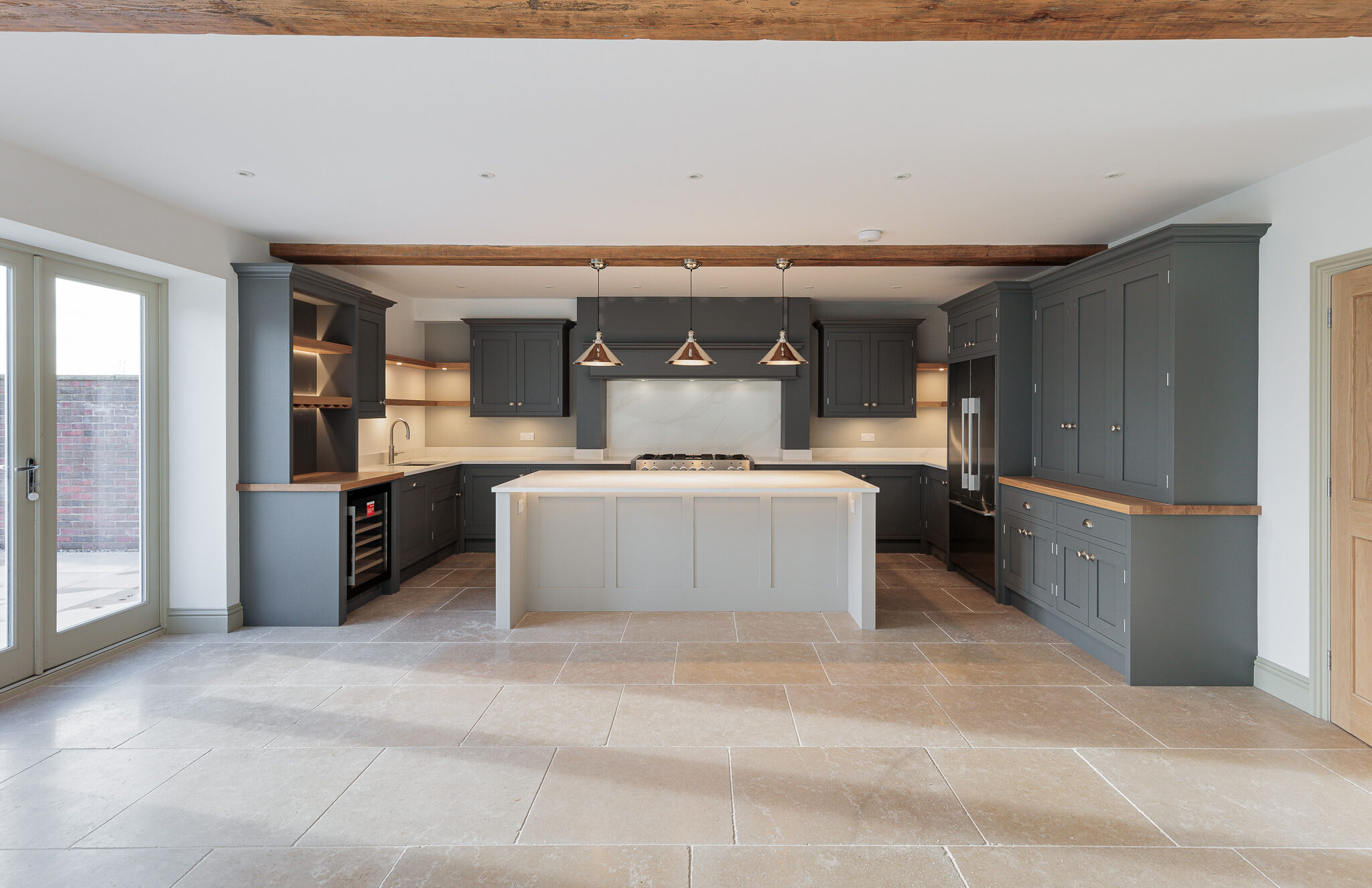 modern kitchen with island and three pendant lights