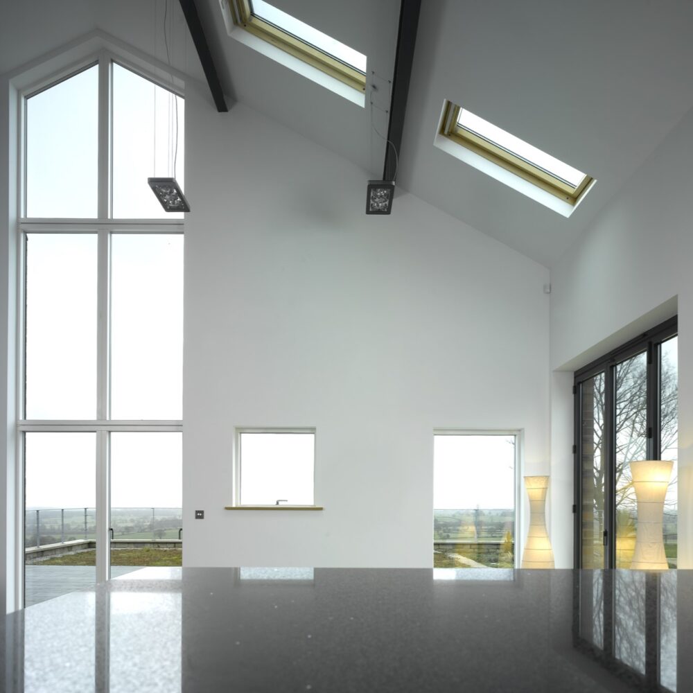 full height gable glazing to barn conversion with views over the surrounding Cheshire hills and countryside. Rooflights, windows and sliding doors providing additional natural light.